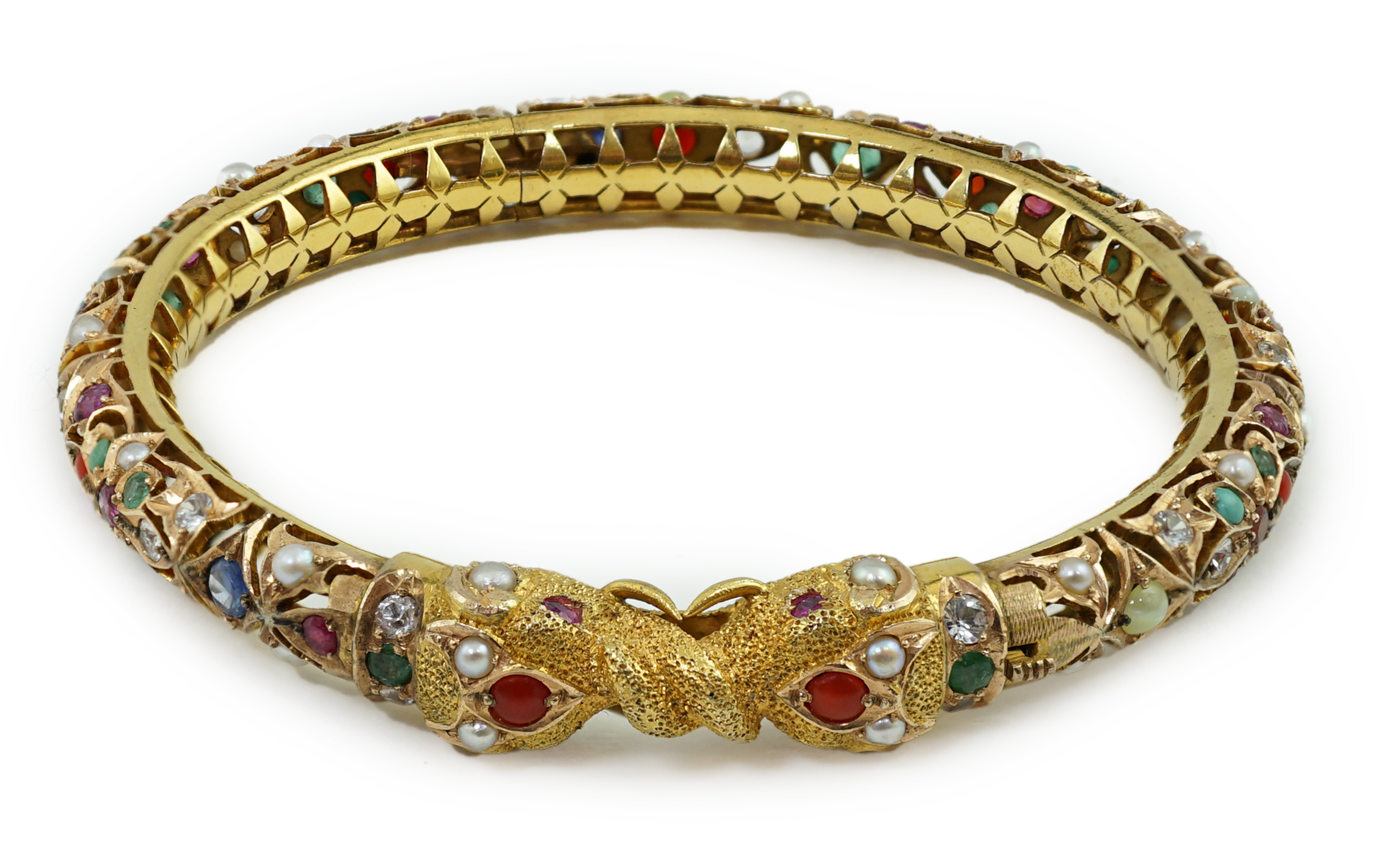 An Indian gold and multi gem set hinged bangle